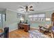 Home office featuring hardwood floors, a ceiling fan and a large window with a view at 5053 Marci Ln, Belmont, NC 28012