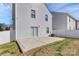 A spacious backyard with a concrete patio and white picket fence at 508 Hawley St, Charlotte, NC 28214