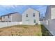 A spacious backyard with a concrete patio and white picket fence at 508 Hawley St, Charlotte, NC 28214