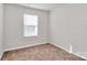 This bedroom has a window and neutral carpet at 508 Hawley St, Charlotte, NC 28214