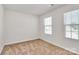 Bedroom featuring neutral carpet and multiple windows at 508 Hawley St, Charlotte, NC 28214