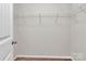 Walk-in closet with wire shelving and neutral carpet at 508 Hawley St, Charlotte, NC 28214