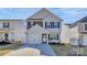 Charming two-story home with a well-manicured lawn and attached garage at 508 Hawley St, Charlotte, NC 28214