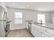 Well-lit kitchen with stainless steel appliances and an island sink at 508 Hawley St, Charlotte, NC 28214