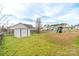 Large, grassy backyard with a shed, playset, and plenty of space for outdoor activities at 552 Montgomery Dr, Rock Hill, SC 29732