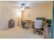 Bright bedroom featuring a ceiling fan, neutral walls, and multiple workstations, creating a functional and inviting space at 552 Montgomery Dr, Rock Hill, SC 29732