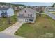 Inviting two-story home boasts a spacious front yard with mature trees at 552 Montgomery Dr, Rock Hill, SC 29732