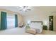 Spacious main bedroom featuring a ceiling fan, a sitting area, and ensuite access at 552 Montgomery Dr, Rock Hill, SC 29732