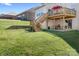 Beautiful backyard featuring a multi-level wooden deck and stairs in a green lawn setting at 7217 Kenyon Dr, Denver, NC 28037