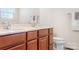 Bathroom features a double sink vanity with modern fixtures, marble countertops, and neutral paint at 7217 Kenyon Dr, Denver, NC 28037