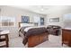 Bedroom with a brown bed, matching furniture, sofa, and Colts decor at 7217 Kenyon Dr, Denver, NC 28037