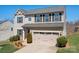 Charming two-story home with a well-manicured lawn and a two-car garage at 7217 Kenyon Dr, Denver, NC 28037