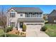 Charming two-story home with a well-manicured lawn and a two-car garage at 7217 Kenyon Dr, Denver, NC 28037