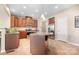 Bright kitchen with stainless steel appliances, island with granite countertops, and tile floors at 7217 Kenyon Dr, Denver, NC 28037
