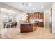 Spacious eat-in kitchen with a large island, granite countertops, stainless appliances, and tile flooring at 7217 Kenyon Dr, Denver, NC 28037
