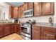 Close-up of a kitchen featuring stainless steel appliances and granite countertops at 7217 Kenyon Dr, Denver, NC 28037
