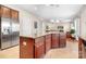Kitchen with a large island that opens to the living room and features stainless steel appliances at 7217 Kenyon Dr, Denver, NC 28037