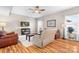 Bright living room with hardwood floors and neutral paint at 7217 Kenyon Dr, Denver, NC 28037
