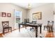Comfortable home office featuring a large desk with chair, neutral walls, and window at 7217 Kenyon Dr, Denver, NC 28037