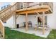 A covered patio with a concrete floor, wooden support beams, and a picnic table at 7217 Kenyon Dr, Denver, NC 28037