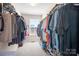 Walk-in closet with ample storage and natural light from a window at 7217 Kenyon Dr, Denver, NC 28037