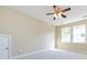 Bright bedroom with carpeted floors, ceiling fan, and double windows providing natural light at 8830 Beaver Creek Dr, Charlotte, NC 28269