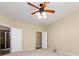 Bedroom with carpet and doorways to a bathroom with glass shower, and one leading to a closet at 8830 Beaver Creek Dr, Charlotte, NC 28269