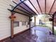 A covered patio features outdoor shade, decor, and privacy at 8830 Beaver Creek Dr, Charlotte, NC 28269