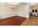 Elegant dining area with hardwood floors and a view into the breakfast bar at 8830 Beaver Creek Dr, Charlotte, NC 28269