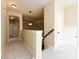 Upstairs hallway with neutral carpet, pendant lighting, and access to bedrooms and other spaces at 8830 Beaver Creek Dr, Charlotte, NC 28269
