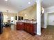 Kitchen area featuring breakfast bar looking to the living room and dining area at 8830 Beaver Creek Dr, Charlotte, NC 28269