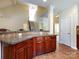 Spacious kitchen featuring a granite breakfast bar and tile floors at 8830 Beaver Creek Dr, Charlotte, NC 28269