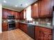 Updated kitchen area featuring stainless steel appliances and decorative backsplash at 8830 Beaver Creek Dr, Charlotte, NC 28269