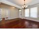 Open-concept living area with hardwood floors, access to another room, and abundant light at 8830 Beaver Creek Dr, Charlotte, NC 28269