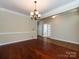 Bright living area with hardwood floors, a fireplace, and adjacent breakfast area at 8830 Beaver Creek Dr, Charlotte, NC 28269
