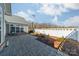 Private fenced backyard with a paved patio and lush landscaping, ideal for outdoor gatherings at 1005 Headwaters Ct, Matthews, NC 28104