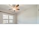 Bedroom with light walls, a ceiling fan, and a window with natural light at 1005 Headwaters Ct, Matthews, NC 28104