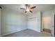 Bright bedroom featuring carpeted floors, a ceiling fan, and a closet at 1005 Headwaters Ct, Matthews, NC 28104