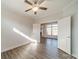 Bedroom with wood floors, tray ceiling, ceiling fan, and lots of natural light at 1005 Headwaters Ct, Matthews, NC 28104
