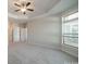 Bedroom with carpeted floors, neutral paint, tray ceiling and lots of light at 1005 Headwaters Ct, Matthews, NC 28104