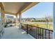 Charming covered porch featuring a railing and offering views of the neighborhood street at 1005 Headwaters Ct, Matthews, NC 28104