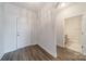 Hallway with view of a half bath, and access to the front door at 1005 Headwaters Ct, Matthews, NC 28104