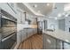 Bright kitchen featuring stainless steel appliances, granite counters, and ample cabinet space at 1005 Headwaters Ct, Matthews, NC 28104