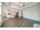 Open floor plan showcasing the kitchen, dining, and living areas with hardwood floors at 1005 Headwaters Ct, Matthews, NC 28104