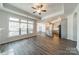 Open-concept living space with kitchen view and large windows offering plenty of natural light at 1005 Headwaters Ct, Matthews, NC 28104