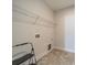 Utility room featuring tile floors and shelving at 1005 Headwaters Ct, Matthews, NC 28104