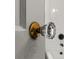 A vintage glass door knob adds charm to this bathroom detail at 108 Colville Rd # 21B, Charlotte, NC 28207
