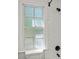 Bathroom window next to a white tiled shower at 108 Colville Rd # 21B, Charlotte, NC 28207