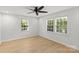 Bright bedroom featuring hardwood floors, ceiling fan, and bright windows at 108 Colville Rd # 21B, Charlotte, NC 28207