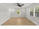 Bright, airy bedroom featuring hardwood floors and light from large windows at 108 Colville Rd # 21B, Charlotte, NC 28207
